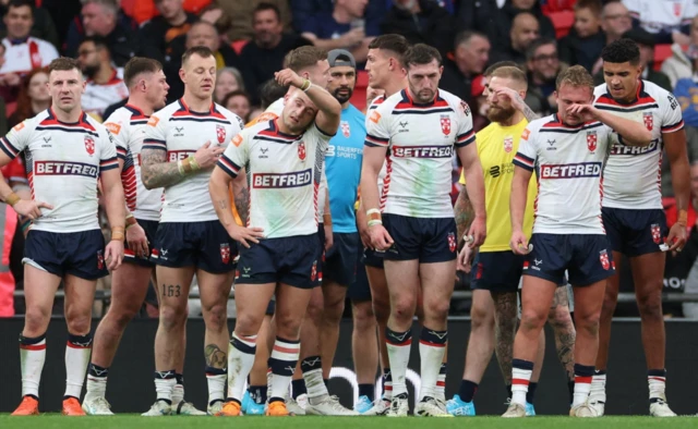 England players react after Australia scores