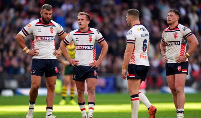 England players look on