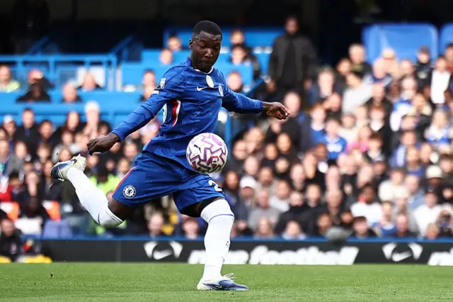 Moises Caicedo takes a shot on the volley