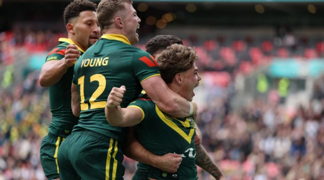 Australia's Reece Walsh celebrates scoring