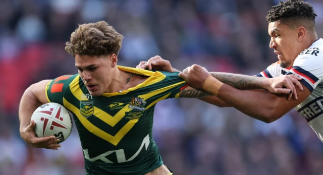 Australia's Reece Walsh in action with England's Kai Pearce-Paul