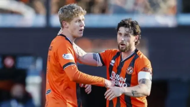 Dundee United's Zac Sapsford celebrates with Will Ferry