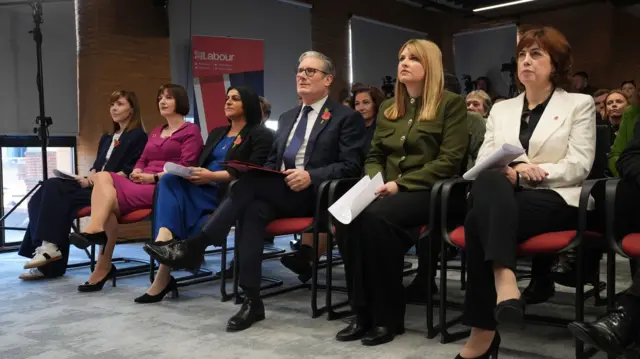 From right to left: Lucy Powel, Labour Party secretary Holly Ridley, Keir Starmer, Shabana Mahmood and Bridget Phillipson sitting down on cushioned plastic chairs inside Labour headquarters