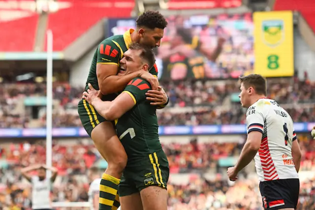 Angus Crichton of Australia Scoring a Try and celebrating with Teammates