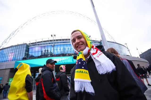Fans outside Wembley pose