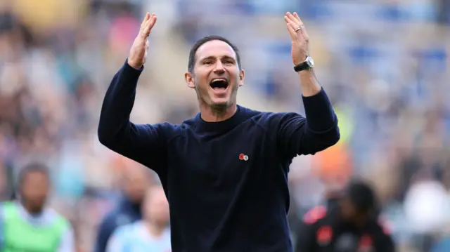 Frank Lampard raises his arms in celebration