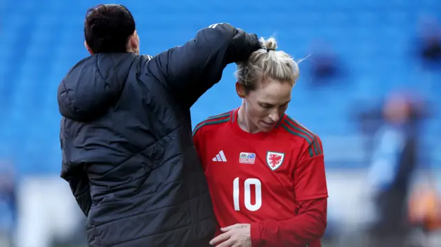 Wilkinson hugs Fishlock as she is replaced