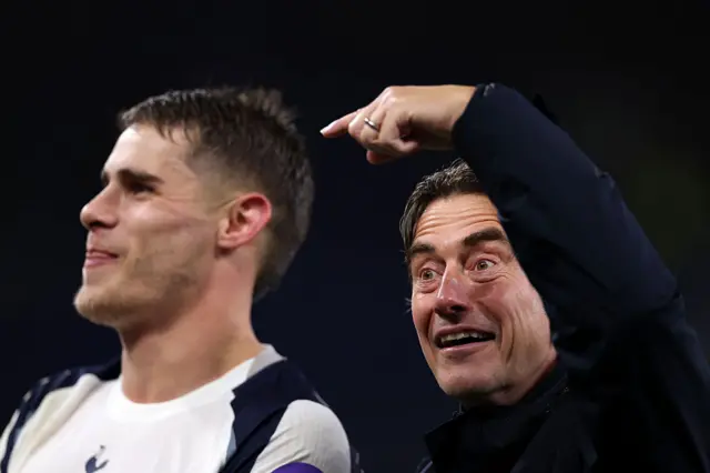 Thomas Frank, Manager of Tottenham Hotspur, gestures towards Micky van de Ven's head as they celebrate their victory following the Premier League match between Everton and Tottenham Hotspur at Hill Dickinson Stadium on October 26, 2025 in Liverpool, England.
