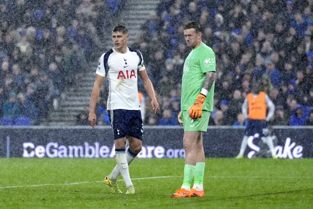 Tottenham Hotspur's Micky van de Ven and Everton goalkeeper Jordan Pickford during the Premier League match at Hill Dickinson Stadium, Everton. Picture date: Sunday October 26, 2025.