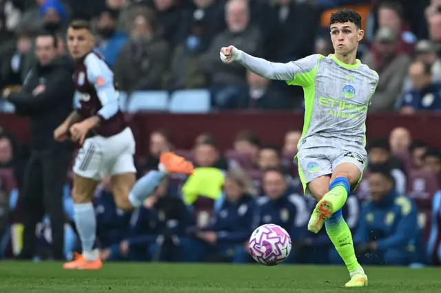 Phil Foden passes the ball for Manchester City