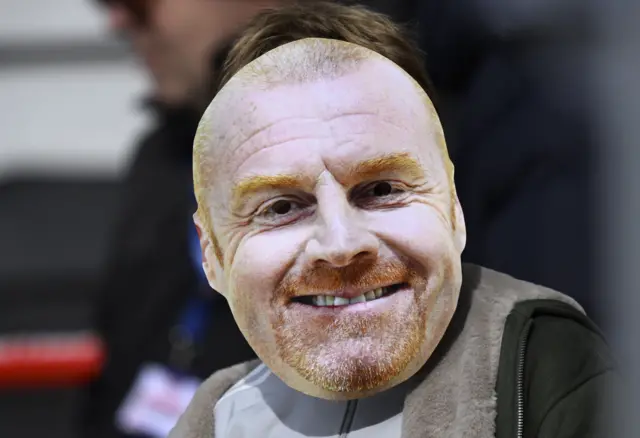 Fan behind a Sean Dyche mask