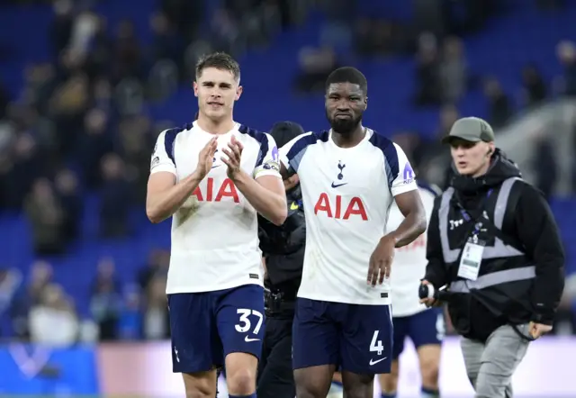Tottenham Hotspur's Micky van de Ven and Kevin Danso applaud the fans following the Premier League match at Hill Dickinson Stadium, Everton.