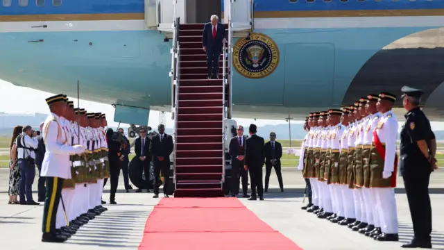 US President Donald Trump disembarks Air Force One at Kuala Lumpur International Airport