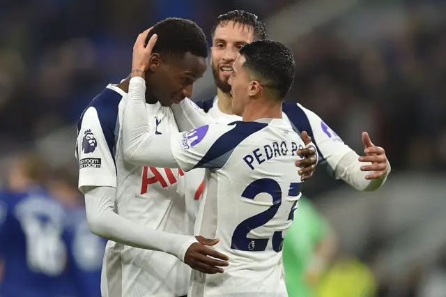 Tottenham Hotspur's Senegalese forward #29 Pape Matar Sarr (L) celebrates with Tottenham Hotspur's Uruguayan midfielder #30 Rodrigo Bentancur (C) and Tottenham Hotspur's Spanish defender #23 Pedro Porro (R) after scoring their third goal during the English Premier League football match between Everton and Tottenham Hotspur at Hill Dickinson Stadium in Liverpool, north west England on October 26, 2025.