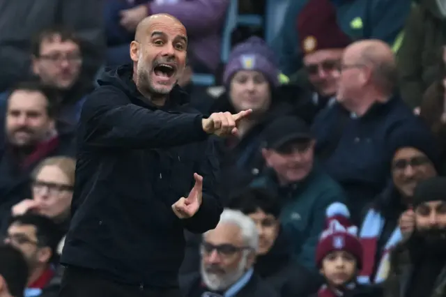 Pep Guardiola reacts at Villa Park