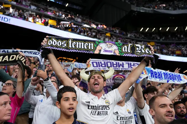 Real Madrid fans with scarves