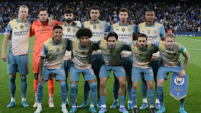 Manchester City in their 'Oasis' themed kit