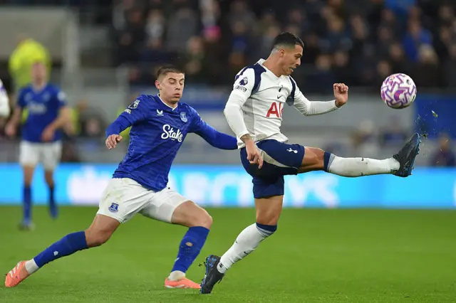 ottenham Hotspur's Spanish defender #23 Pedro Porro (R) clears under pressure from Everton's Ukrainian defender #16 Vitaliy Mykolenko (L) during the English Premier League football match between Everton and Tottenham Hotspur at Hill Dickinson Stadium in Liverpool, north west England on October 26, 2025.