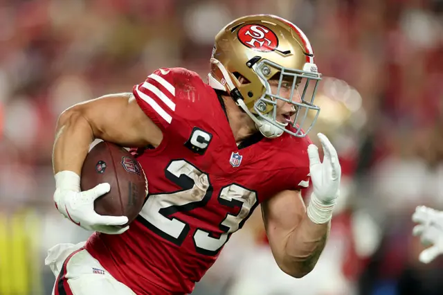 Christian McCaffrey running with the ball