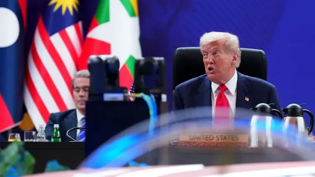 US President Donald Trump speaks from a podium