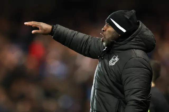 Port Vale boss Darren Moore instructs his players versus Stockport County