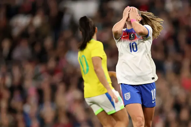 Toone reacts to a missed chance by covering her face with her hands