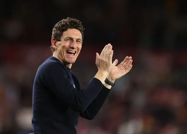 Keith Andrews smiling and applauding