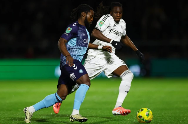 Wycombe Wanderers' Fred Onyedinma in action with Fulham's Calvin Bassey