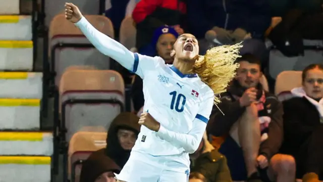 Sydney Schertenleib celebrates