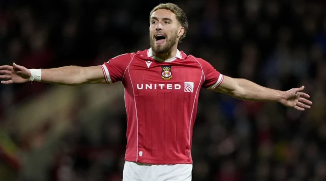 Wrexham's Sam Smith in action