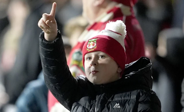 A young Wrexham fan ahead of the Carabao Cup