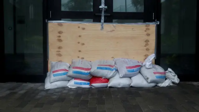 Sandbags are placed at the doors of AC Hotel Kingston, as Hurricane Melissa is expected to make landfall in Kingston, Jamaica,