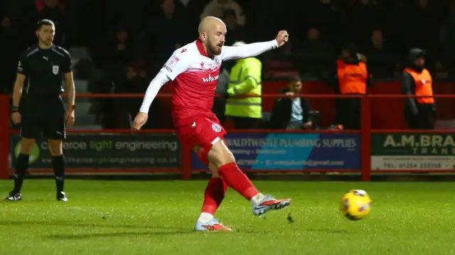 Paddy Madden takes a penalty kick for Accrington Stanley