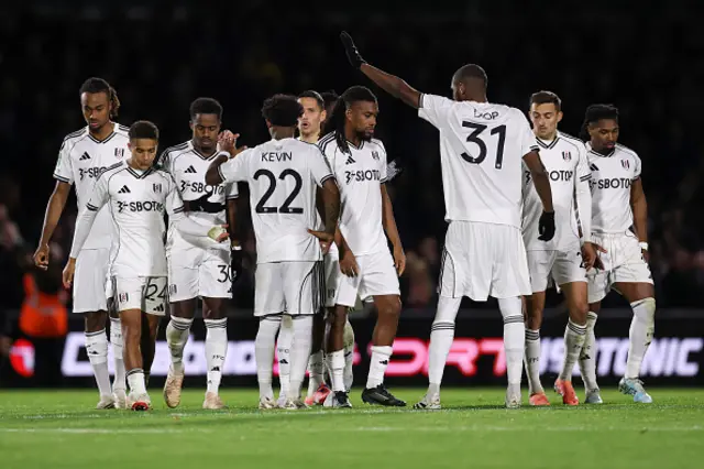 Ryan Sessegnon of Fulham is consoled by teammates after missing the team's fifth penalty