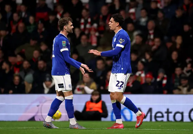 Yousef Salech of Cardiff City celebrates scoring his team's first goal with teammate Calum Chambers