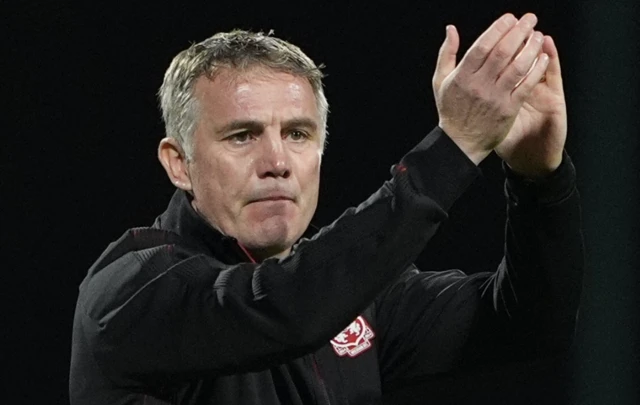 Wrexham manager Phil Parkinson applauds the fans