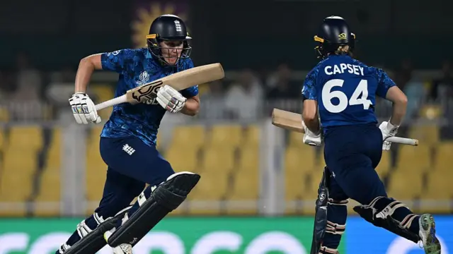 Nat Sciver-Brunt of England (L) runs between the wicket with team mate Alice Capsey