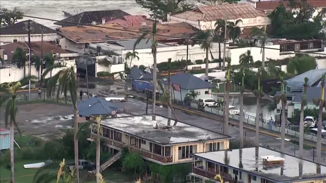 Destroyed buildings and shattered palm trees in Montego Bay, Jamaica