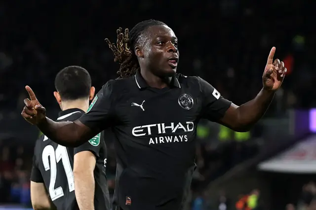 Jeremy Doku of Manchester City celebrates scoring his team's first goal