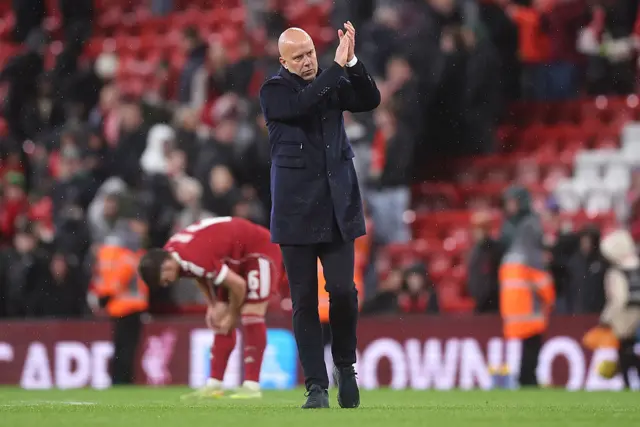 Liverpool Manager Arne Slot applauds the home fans