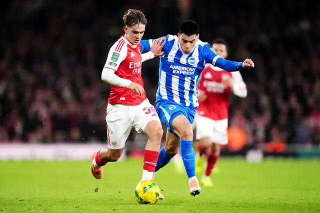 Arsenal's Max Dowman (left) and Brighton and Hove Albion's Maxim De Cuyper battle for the ball