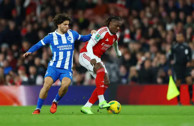 Brighton & Hove Albion's Ferdi Kadioglu in action with Arsenal's Eberechi Eze