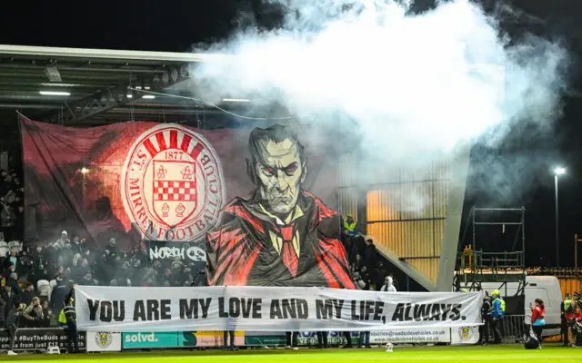 Fans with a spooktacular banner