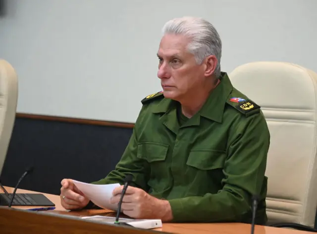 Cuba President Miguel Díaz-Canel Bermúdez holds paper as he delivers remarks to officials