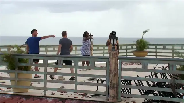 People examine the damage after Hurricane Melissa in Montego Bay, Jamaica