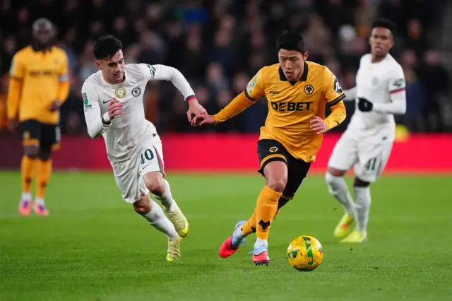 Chelsea's Facundo Buonanotte (second from left) and Wolverhampton Wanderers' Hwang Hee-Chan battle for the ball