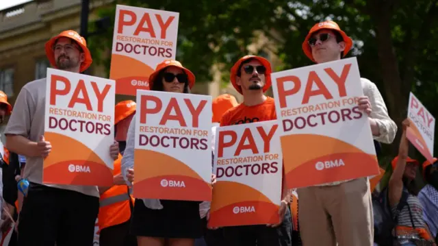 doctors protesting outside Downing Street in June
