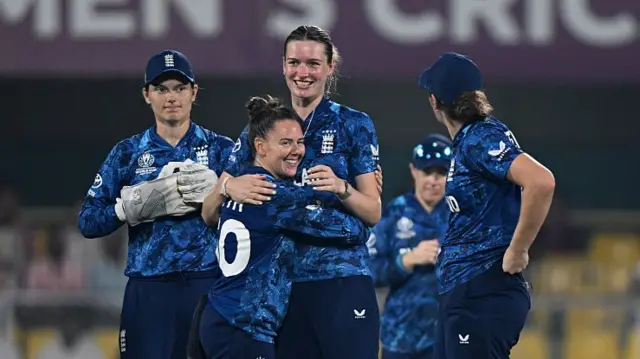 : Lauren Bell of England celebrates with team mate Linsey Smith after taking the wicket of Sinalo Jafta
