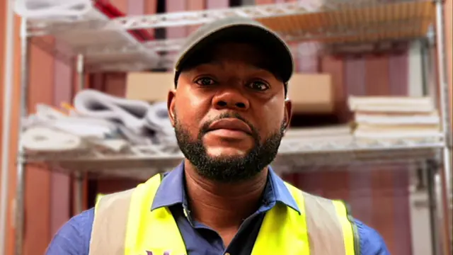 Richard Vernon looks to camera as he speaks to BBC - he is wearing a high vis jacket