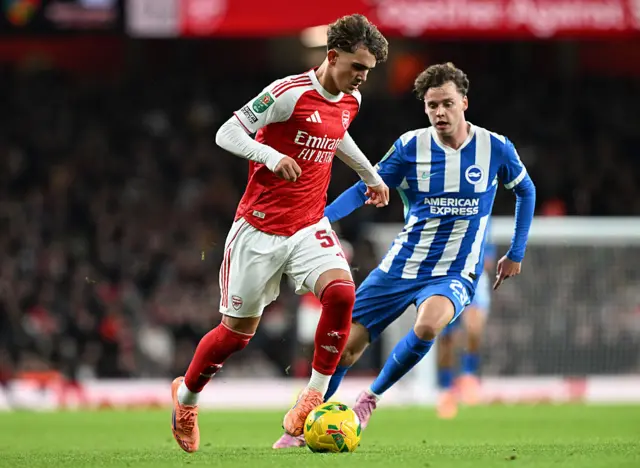 Max Dowman of Arsenal runs with the ball whilst under pressure from Maxim De Cuyper of Brighton & Hove Albion during the Carabao Cup Fourth Round match between Arsenal and Brighton & Hove Albion at Emirates Stadium on October 29, 2025 in London, England.